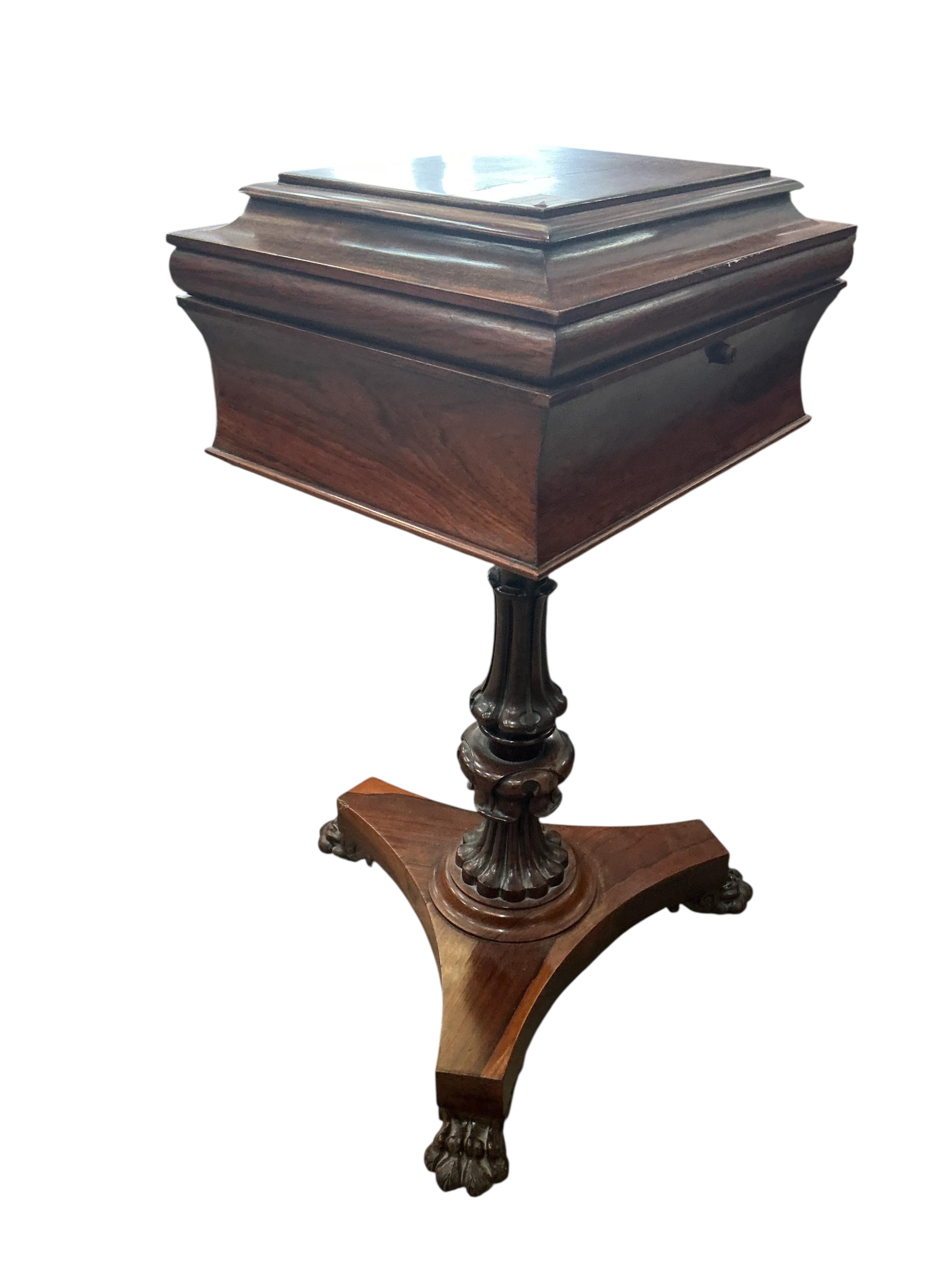 An early Victorian rosewood teapoy, on triangular platform and lion's paw feet, width 40cm, depth 33cm, height 78cm